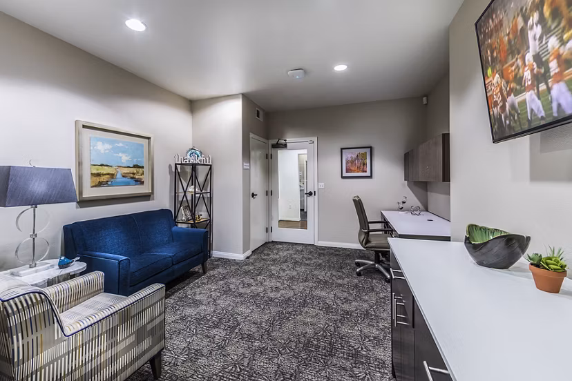 Modern business center with communal desks at Overture Rancho Santa Margarita Active Adult Apartments