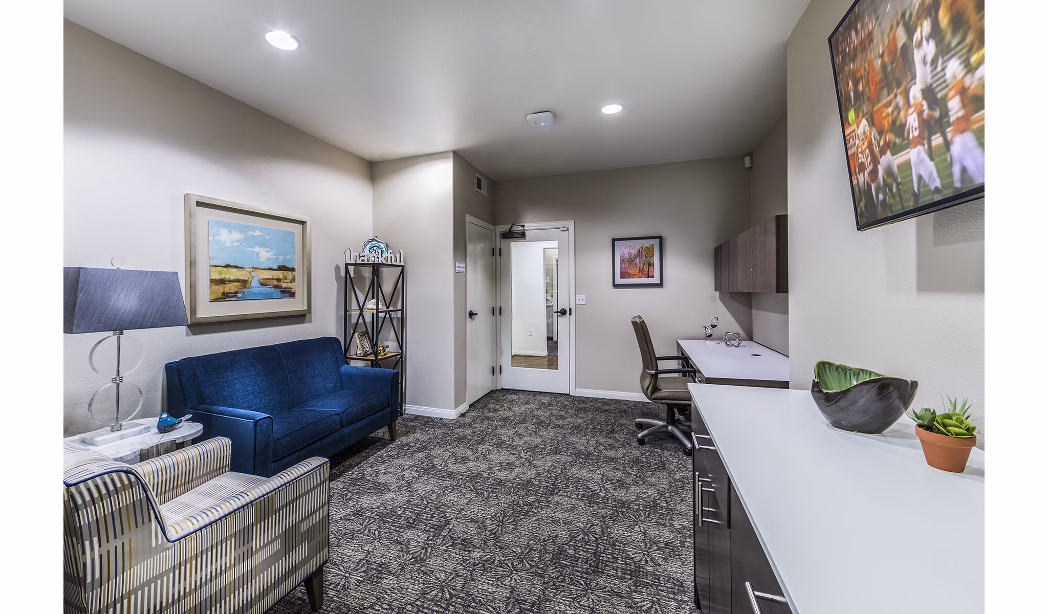 Modern business center with communal desks at Overture Rancho Santa Margarita Active Adult Apartments