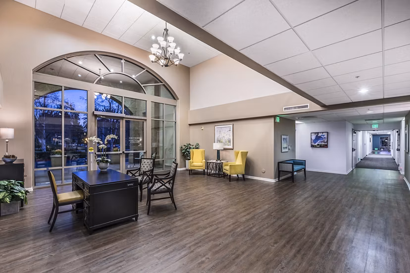 Clubhouse featuring modern lounge and dining areas at Overture Rancho Santa Margarita Active Adult Apartments