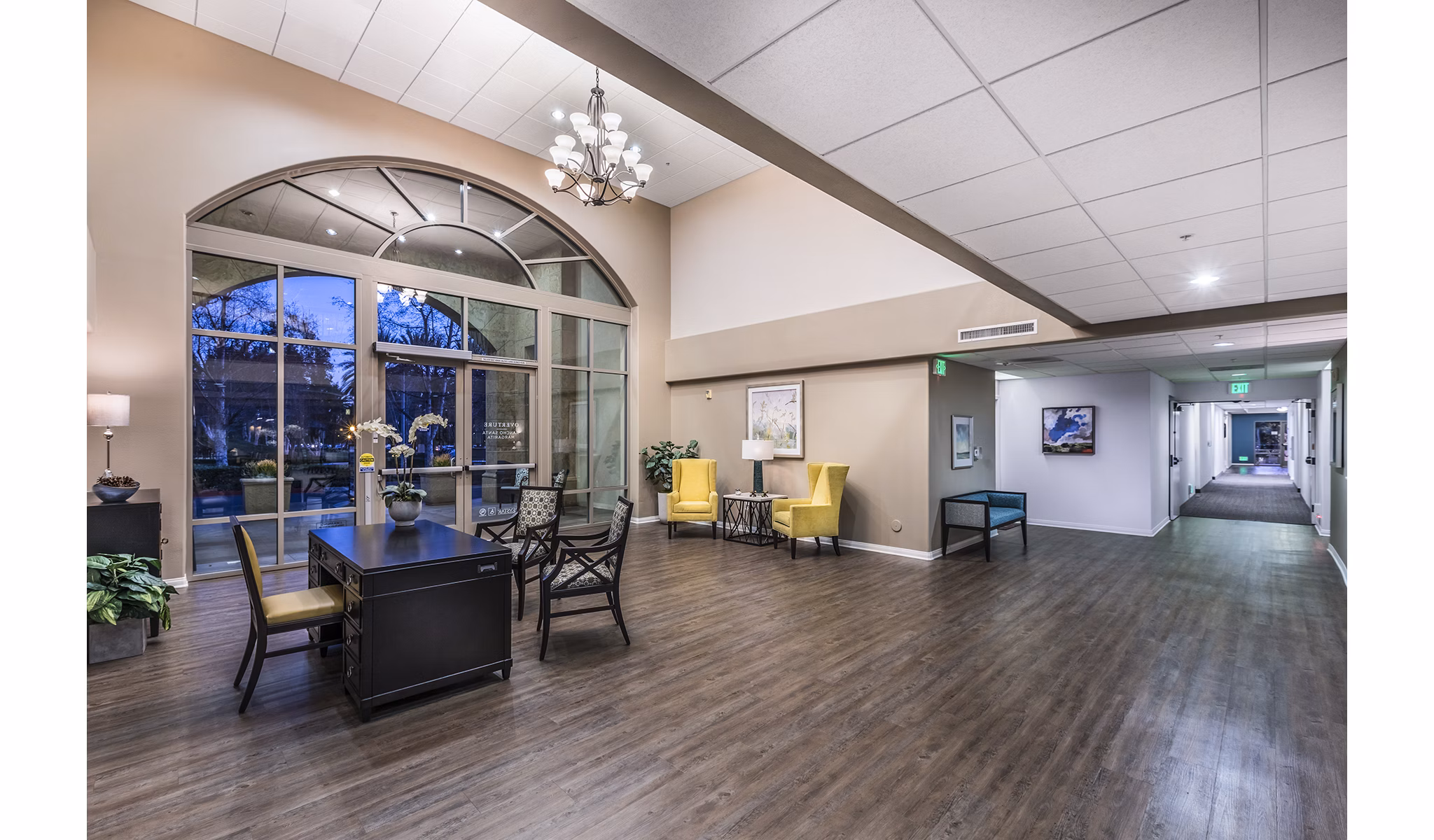 Clubhouse featuring modern lounge and dining areas at Overture Rancho Santa Margarita Active Adult Apartments