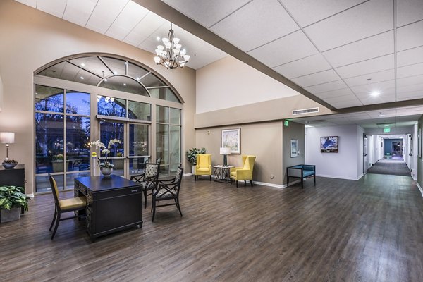 Clubhouse featuring modern lounge and dining areas at Overture Rancho Santa Margarita Active Adult Apartments