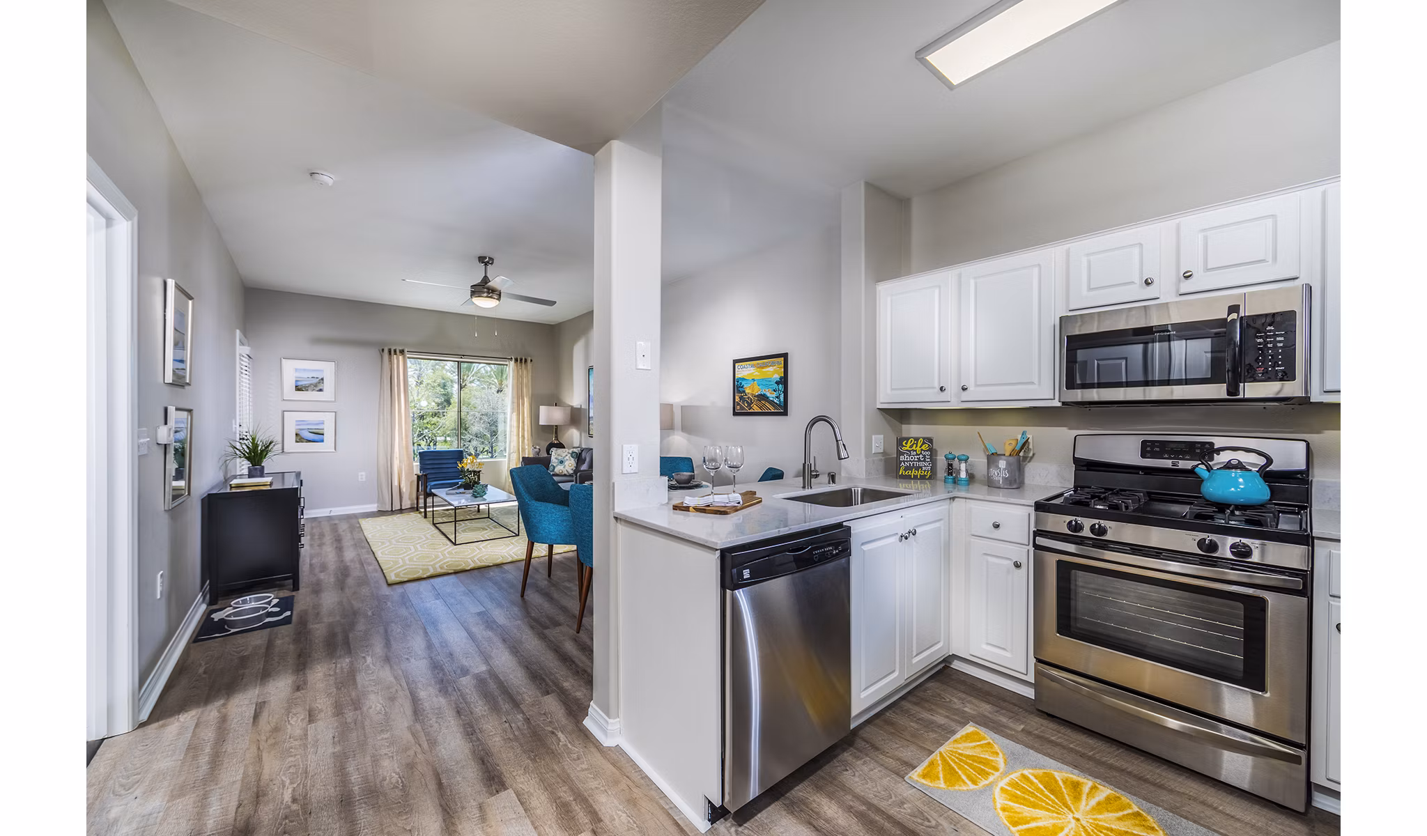 Modern kitchen with stainless steel appliances at Overture Rancho Santa Margarita Active Adult Apartments