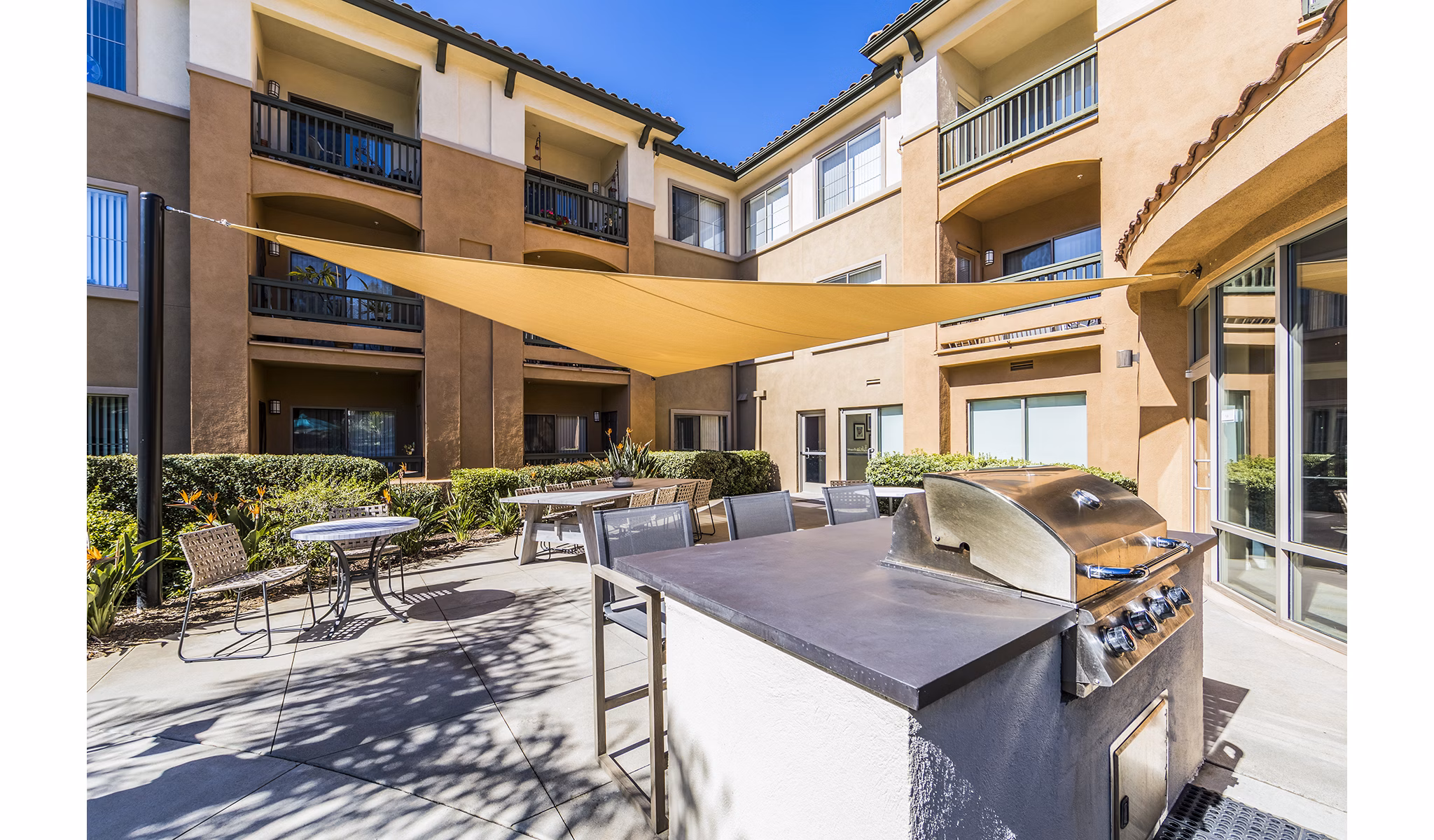 Grill area with modern amenities at Overture Rancho Santa Margarita Active Adult Apartments, perfect for outdoor gatherings and socializing