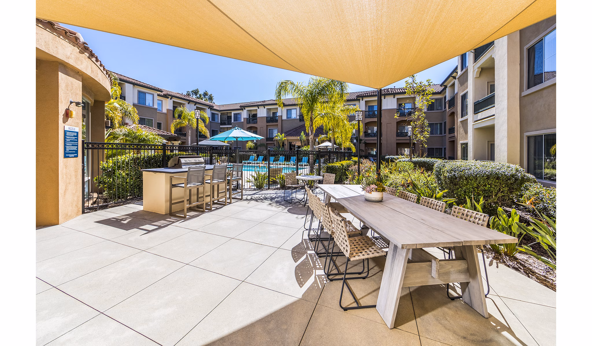 Outdoor grill area at Overture Rancho Santa Margarita Active Adult Apartments featuring modern amenities