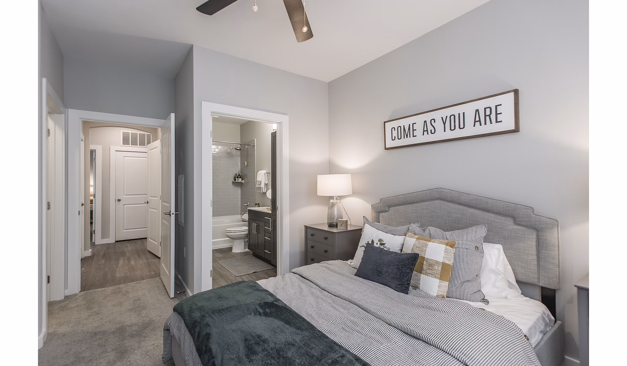 Elegant bedroom with designer decor in Novel Lockwood Glen Apartments, luxury community by Greystar