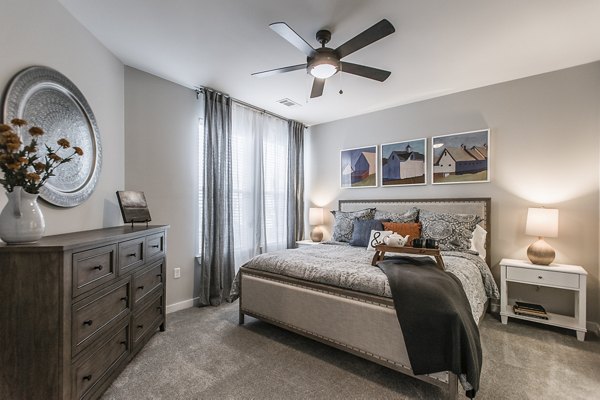 Cozy bedroom with modern furnishings at Novel Lockwood Glen Apartments