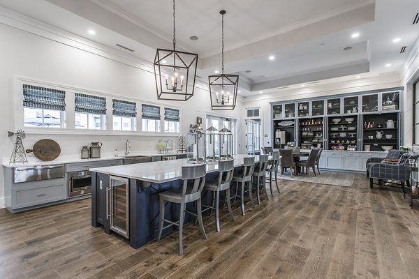 Modern clubhouse with lounge seating and games at Novel Lockwood Glen Apartments, a Greystar luxury apartment community
