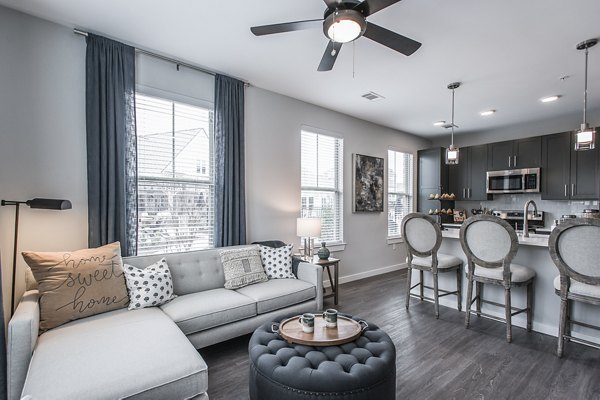 Spacious living room with modern decor at Novel Lockwood Glen Apartments, Franklin