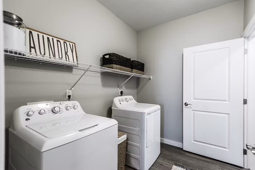 Laundry room with modern appliances at Novel Lockwood Glen Apartments