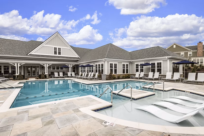 Relaxing pool area with stylish loungers at Novel Lockwood Glen Apartments