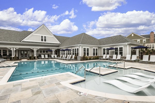 Relaxing pool area with stylish loungers at Novel Lockwood Glen Apartments