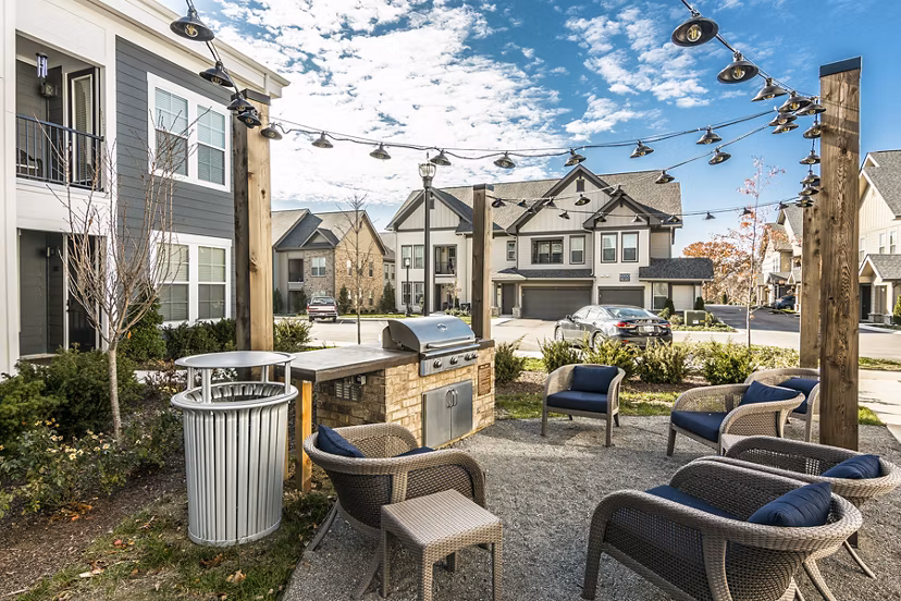 Grill area featuring modern outdoor furniture at Novel Lockwood Glen Apartments