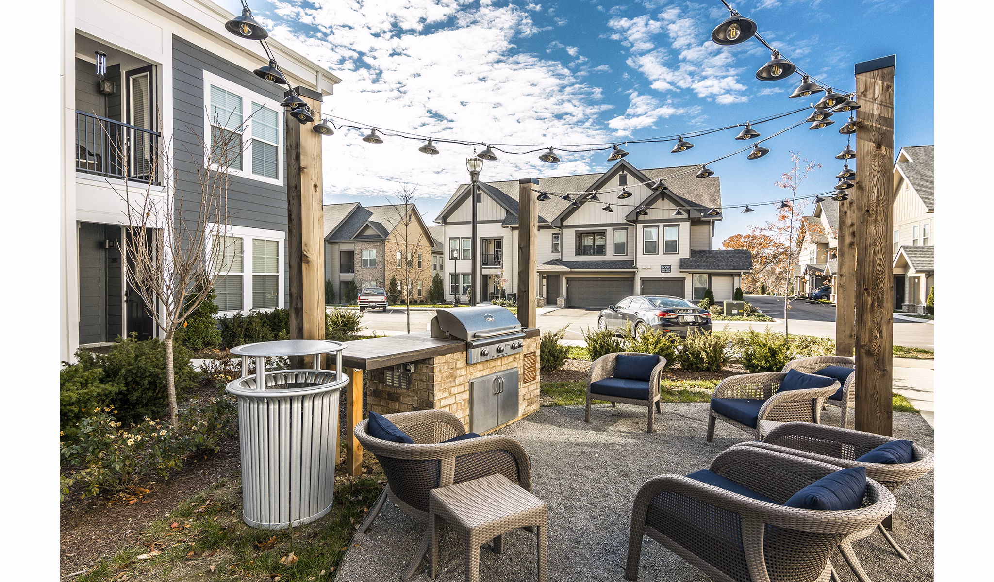 Grill area featuring modern outdoor furniture at Novel Lockwood Glen Apartments