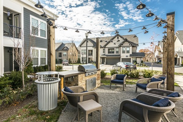 Grill area featuring modern outdoor furniture at Novel Lockwood Glen Apartments