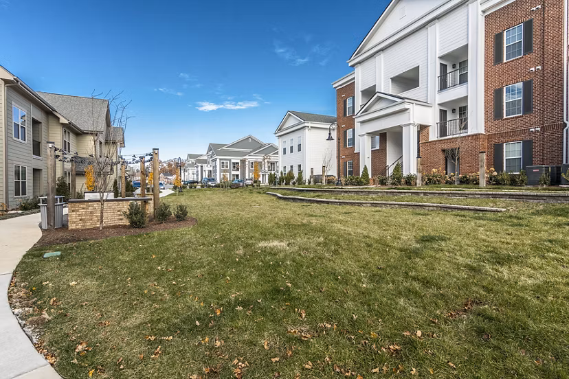 Courtyard with lush landscaping and seating areas at Novel Lockwood Glen Apartments