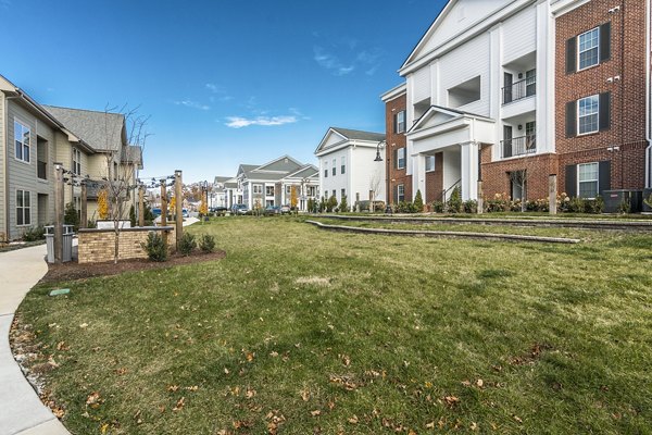 Courtyard with lush landscaping and seating areas at Novel Lockwood Glen Apartments