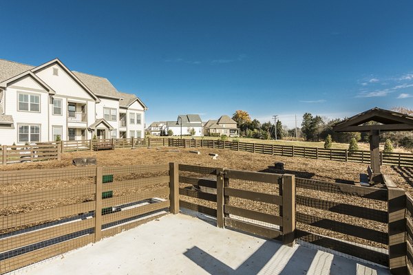 Dog park with agility equipment at Novel Lockwood Glen Apartments, offering a pet-friendly environment for residents in scenic surroundings