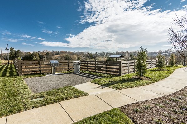 Outdoor grill area for social gatherings at Novel Lockwood Glen Apartments, offering a luxury community experience