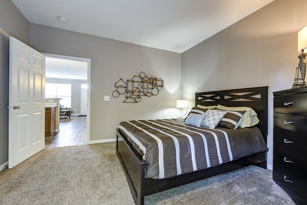 Cozy bedroom design with modern furnishings at Summit Pointe Apartments