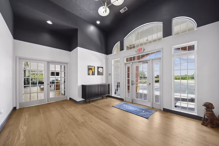 Modern business center with workstations at Summit Pointe Apartments, featuring comfortable seating and high-speed internet access for residents