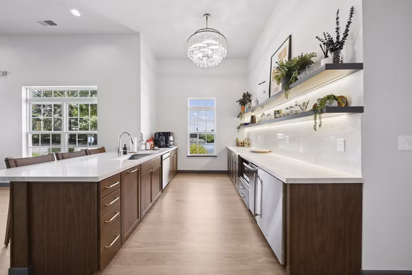 Clubhouse with modern design and plush seating at Summit Pointe Apartments, a luxury community for social gatherings and relaxation