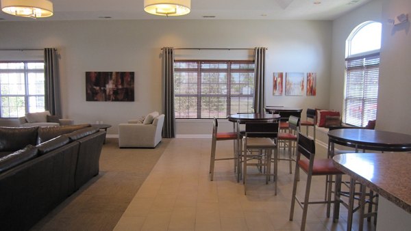 Clubhouse with modern design and plush seating at Summit Pointe Apartments, a luxury community for social gatherings and relaxation
