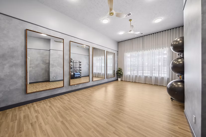 Fully-equipped fitness center with modern gym equipment at Summit Pointe Apartments