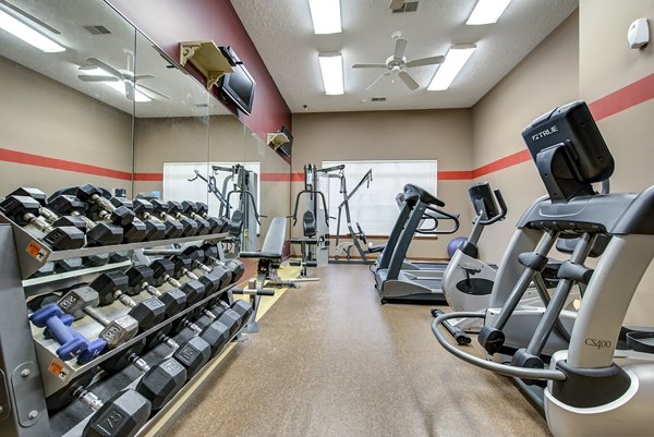Fully-equipped fitness center with modern gym equipment at Summit Pointe Apartments