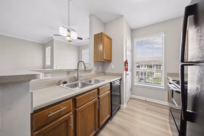 Kitchen featuring modern appliances and granite countertops in Summit Pointe Apartments