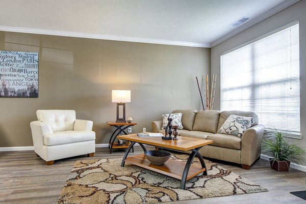 Inviting living room with modern furnishings and ample natural light at Summit Pointe Apartments