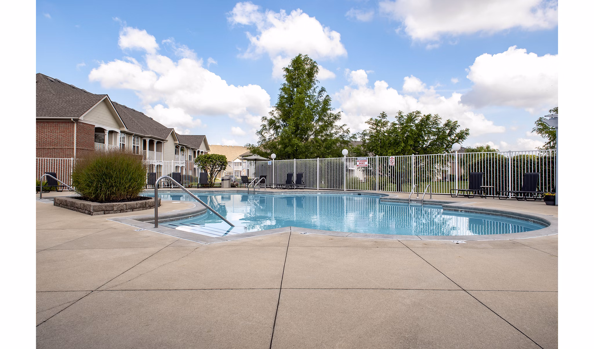Resort-style outdoor pool at Summit Pointe Apartments offering leisure and relaxation for residents in luxurious surroundings