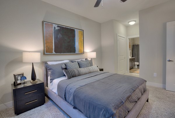 Cozy bedroom with natural light at Lakeview Villas Apartments