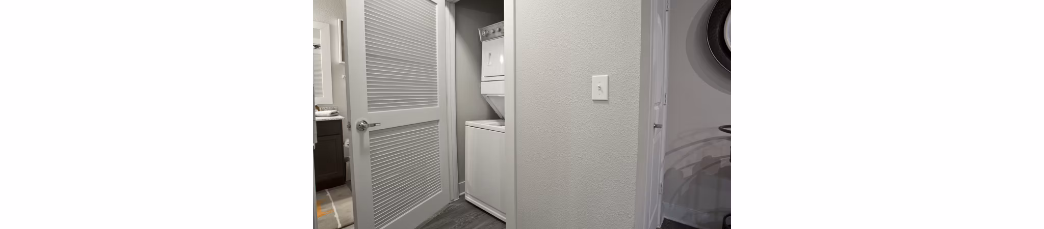 Laundry room with modern appliances at Lakeview Villas Apartments