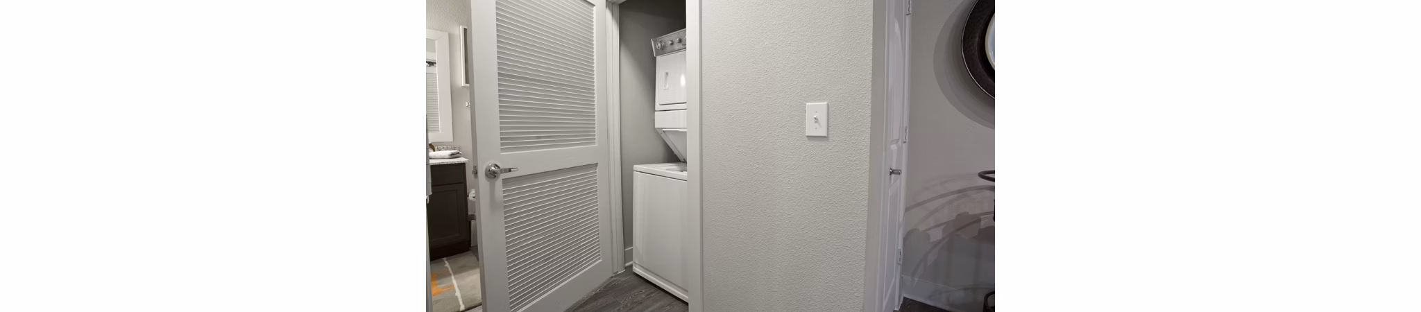 Laundry room with modern appliances at Lakeview Villas Apartments