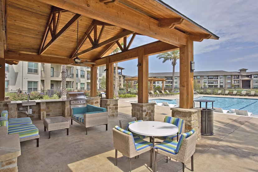 Outdoor grill area with modern seating at Lakeview Villas Apartments
