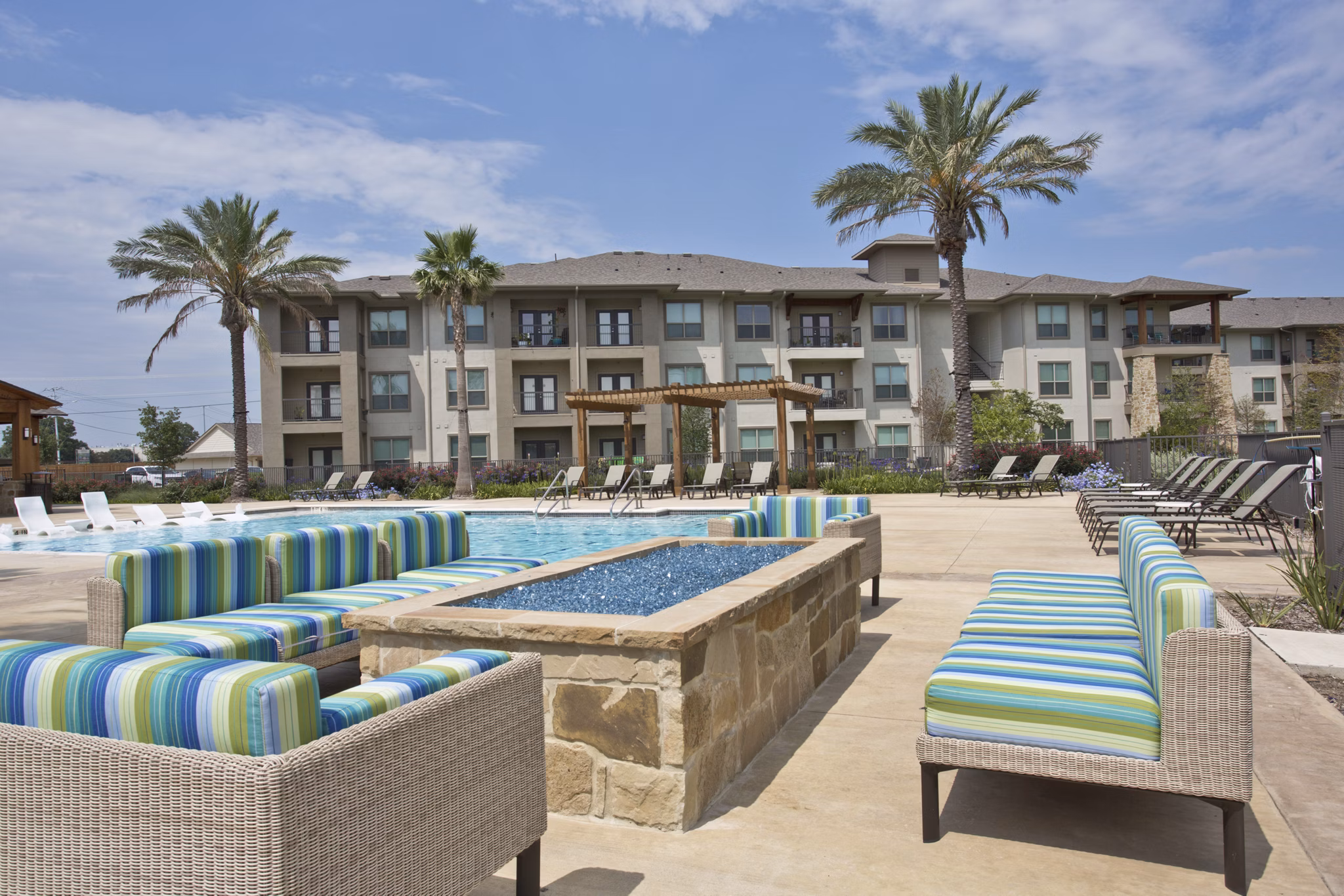 Fire pit and seating area at Lakeview Villas Apartments, offering a cozy outdoor gathering space for residents