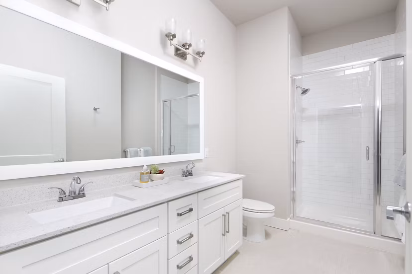 The Glenn Apartments: Modern bathroom with sleek fixtures in luxury Greystar property
