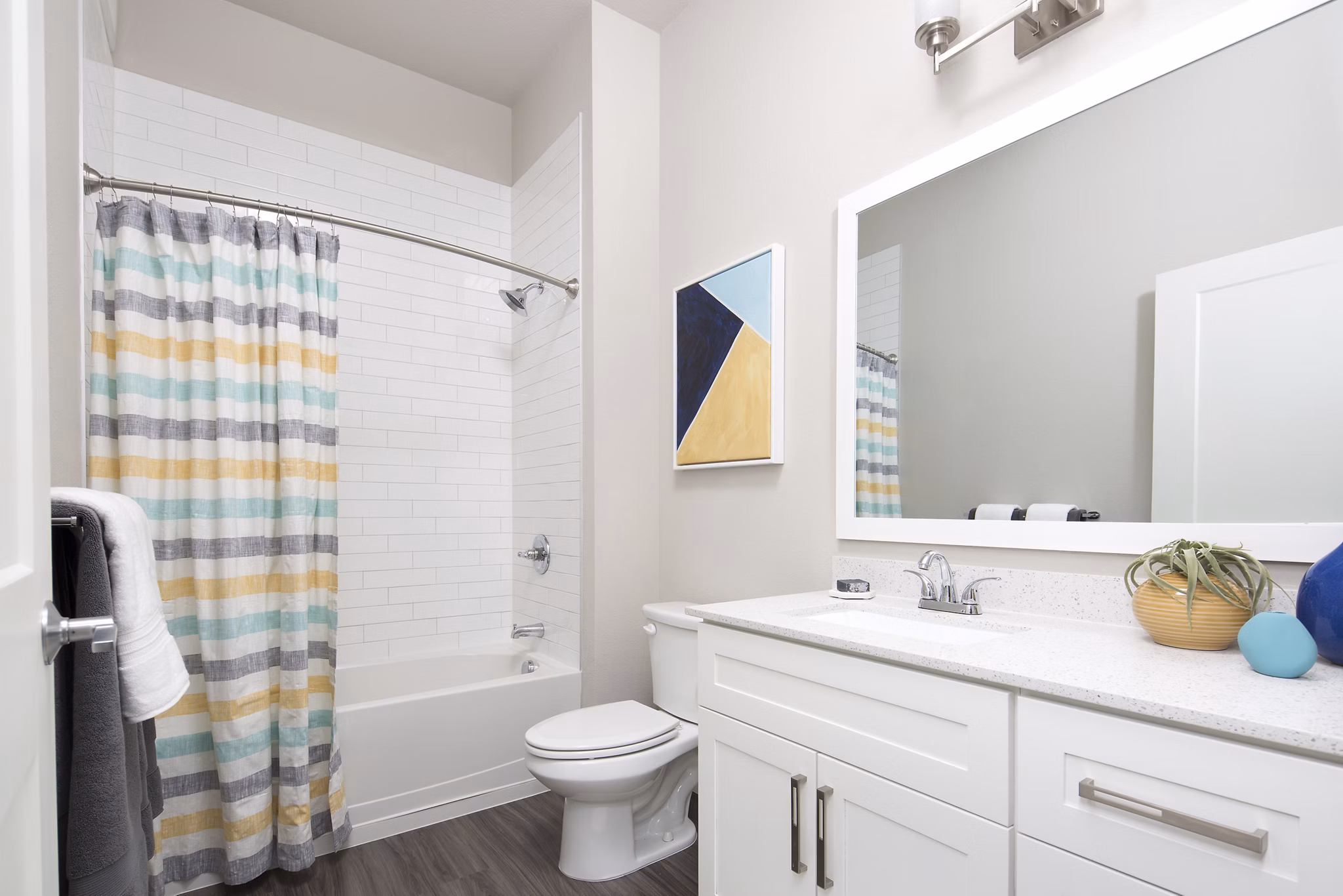 Bathroom with modern fixtures and marble countertops at The Glenn Apartments, luxury living by Greystar