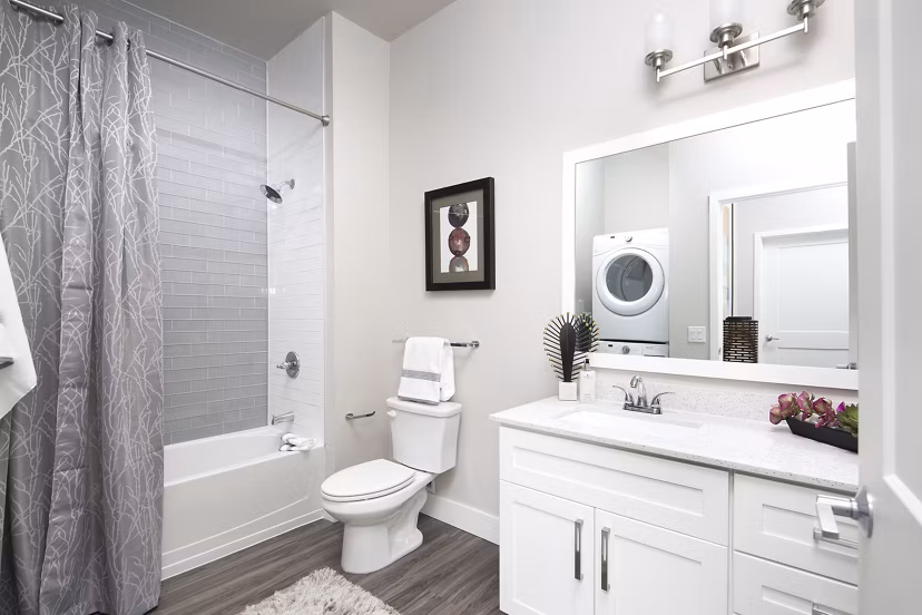 The Glenn Apartments: Modern bathroom with sleek finishes and ample lighting in luxury high-rise