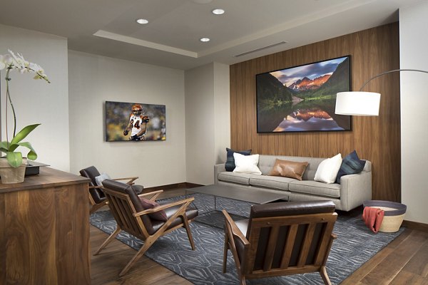 The Glenn Apartments: Modern clubhouse with stylish decor and seating areas, perfect for social gatherings in a luxury community