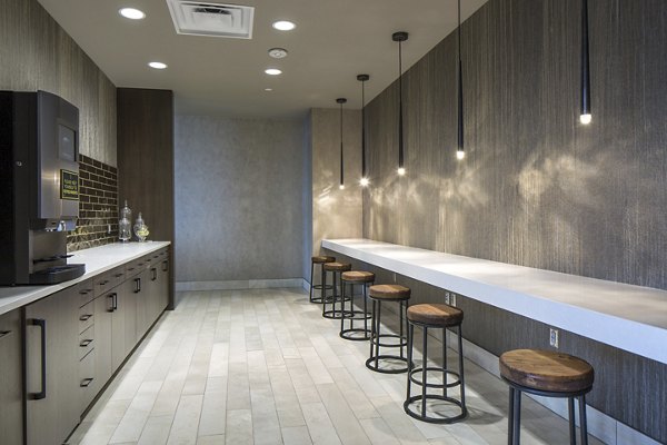 Modern clubhouse with cozy seating and fireplace at The Glenn Apartments in vibrant community