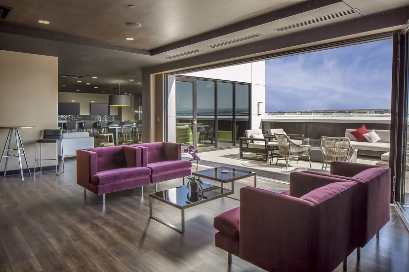 Clubhouse with stylish lounge area and modern decor at The Glenn Apartments, a premium Greystar community