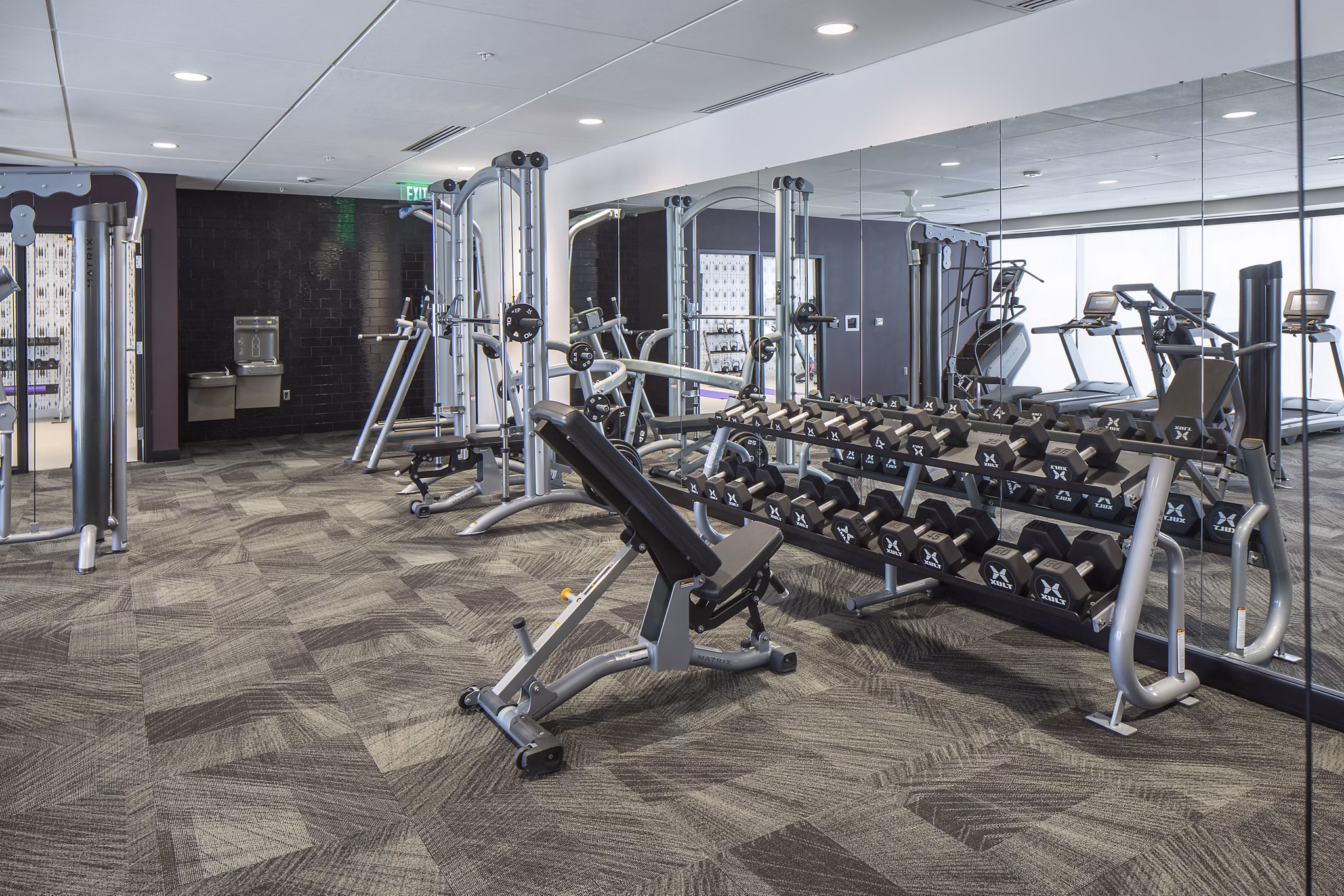 State-of-the-art fitness center with modern equipment at The Glenn Apartments