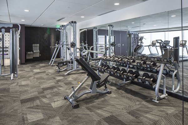 State-of-the-art fitness center with modern equipment at The Glenn Apartments
