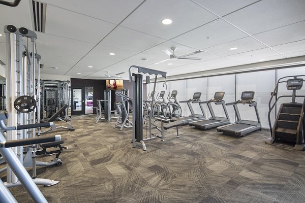 Modern fitness center featuring state-of-the-art equipment at The Glenn Apartments