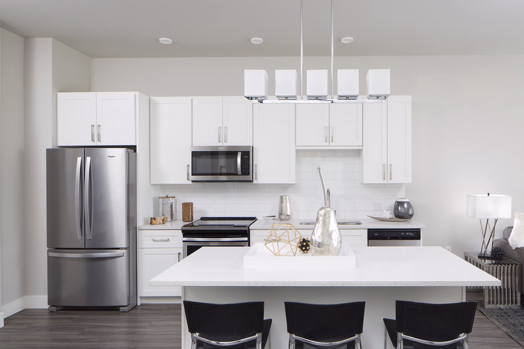 Modern kitchen with stainless steel appliances at The Glenn Apartments