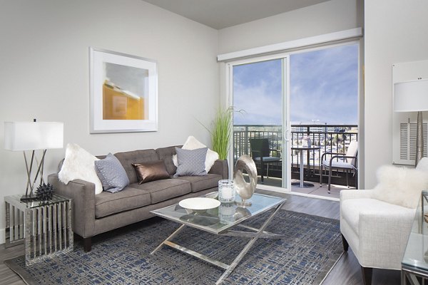 Spacious living room with modern decor at The Glenn Apartments offering luxury living