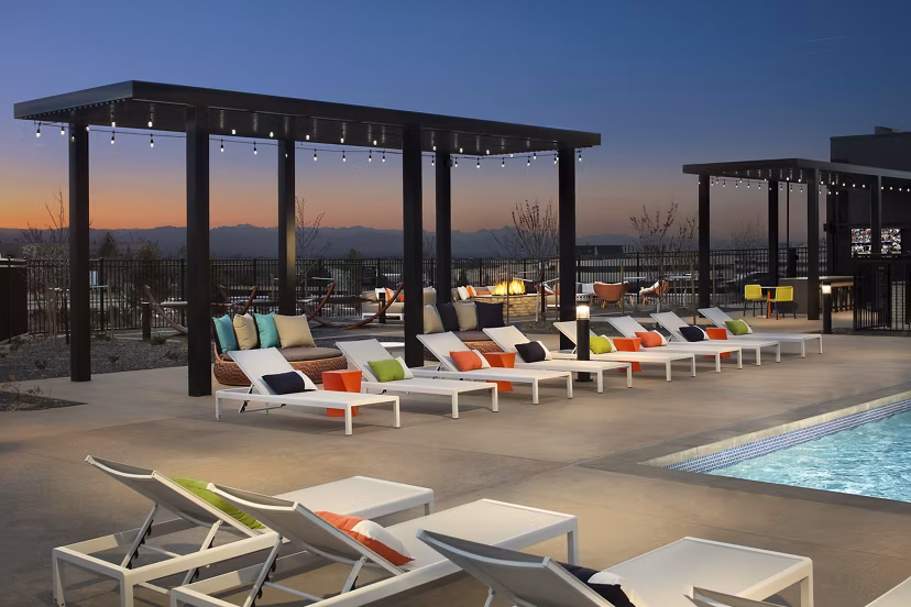 Relaxing pool area at The Glenn Apartments with modern design and lounge seating