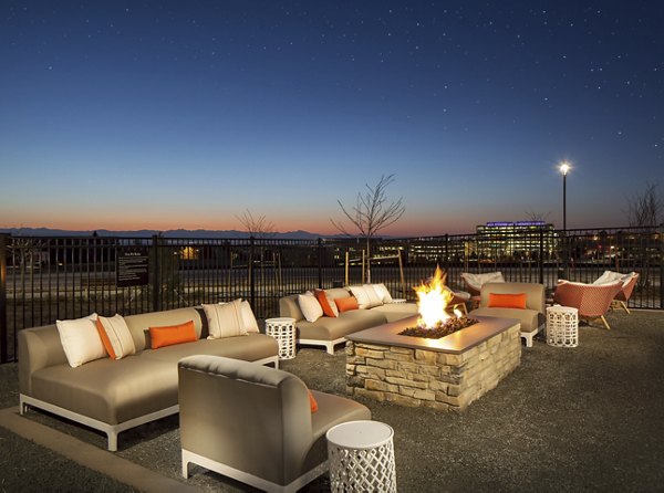 Cozy outdoor fire pit area at The Glenn Apartments, perfect for gatherings and relaxation in a luxury setting