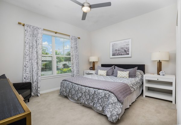 Bedroom featuring modern decor and ample natural light in Overture West Ashley Apartments, luxury apartments by Greystar